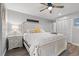 This spacious bedroom features a ceiling fan, hardwood floors, and a large closet for ample storage at 223 Maison Dr. # C-13, Myrtle Beach, SC 29572