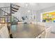Inviting dining room featuring a unique spiral staircase, coffee bar, and view into the living room at 223 Maison Dr. # C-13, Myrtle Beach, SC 29572