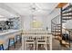 Charming dining area with spiral staircase, modern lighting, and an adjacent open kitchen at 223 Maison Dr. # C-13, Myrtle Beach, SC 29572