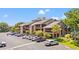 Beautiful condo building featuring palm trees and multiple balconies perfect for relaxation at 223 Maison Dr. # C-13, Myrtle Beach, SC 29572
