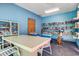 Amenity space with bookshelves and a folding table and chairs at 223 Maison Dr. # C-13, Myrtle Beach, SC 29572