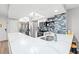 Bright kitchen featuring white cabinets, stainless steel appliances, and a stylish backsplash at 223 Maison Dr. # C-13, Myrtle Beach, SC 29572