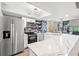 Well-lit kitchen boasting stainless steel appliances, stylish backsplash, and an adjacent dining area at 223 Maison Dr. # C-13, Myrtle Beach, SC 29572