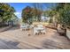 Spacious outdoor patio area, furnished with tables, chairs and bench seating at 223 Maison Dr. # C-13, Myrtle Beach, SC 29572
