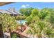 Aerial view of pool surrounded by landscaping and nearby buildings at 223 Maison Dr. # C-13, Myrtle Beach, SC 29572