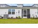 Backyard featuring manicured lawn and a screened in porch with a grill at 2352 Elowen Ln. # 22B, Longs, SC 29568