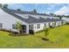 This aerial showcases a well-maintained backyard with green lawns and new landscaping around the perimeter at 2352 Elowen Ln. # 22B, Longs, SC 29568