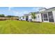 View of manicured backyard lawn with neighboring building under construction in the background at 2352 Elowen Ln. # 22B, Longs, SC 29568