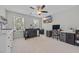 Bright bedroom featuring neutral walls, carpet, and a ceiling fan above the dark office furniture at 2352 Elowen Ln. # 22B, Longs, SC 29568