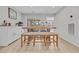 Cozy dining area with a rustic wooden table and bench seating, perfect for Gathering meals and gatherings at 2352 Elowen Ln. # 22B, Longs, SC 29568