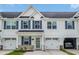 Exterior showcasing a charming townhouse with blue shutters, and well-kept landscaping at 2352 Elowen Ln. # 22B, Longs, SC 29568