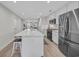 Stylish kitchen with stainless steel appliances, white cabinetry, and a large island, ideal for cooking and socializing at 2352 Elowen Ln. # 22B, Longs, SC 29568