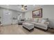 Cozy living room featuring neutral decor, wood-look floors, and ample natural light at 2352 Elowen Ln. # 22B, Longs, SC 29568