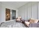 Enclosed sunroom has plush chairs and overlooks the backyard with the sliding glass door at 2352 Elowen Ln. # 22B, Longs, SC 29568