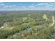 Scenic aerial shot of a home in a wooded area, highlighting the neighborhood's green landscape at 24 Gate 7, Carolina Shores, NC 28467