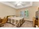 Comfortable bedroom with tray ceilings, shuttered windows, and ample natural light at 24 Gate 7, Carolina Shores, NC 28467
