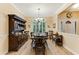 Formal dining area featuring a large hutch, wood floors, and a window providing natural light at 24 Gate 7, Carolina Shores, NC 28467