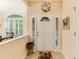 Bright foyer with decorative door, sidelights, tiled floor and beautiful decorative wreath at 24 Gate 7, Carolina Shores, NC 28467