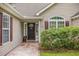 Inviting front entrance featuring a decorative walkway, tasteful landscaping, and stylish front door at 24 Gate 7, Carolina Shores, NC 28467