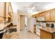The kitchen features oak cabinets, tile floors, and a serving area at 24 Gate 7, Carolina Shores, NC 28467