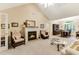 Open living space with a cozy fireplace and seamless flow into the dining area at 24 Gate 7, Carolina Shores, NC 28467