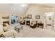 Comfortable living room boasts vaulted ceilings, fireplace, neutral tones, and an open layout at 24 Gate 7, Carolina Shores, NC 28467