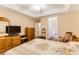 Cozy bedroom features a ceiling fan, wood furniture, and an en-suite bathroom at 24 Gate 7, Carolina Shores, NC 28467