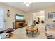 Comfortable sitting room featuring a mounted TV and views to the dining area and living room at 24 Gate 7, Carolina Shores, NC 28467
