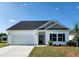 Charming single-story home with a two car garage, neutral paint, and dark roof at 262 Dunlin Pl, Conway, SC 29526