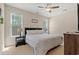 Bright bedroom features plush carpet, a ceiling fan, and natural light at 309 Foxpath Loop, Myrtle Beach, SC 29588