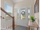 Bright entryway with a patterned glass door, side lights, wood floors and a view of the stairs at 309 Foxpath Loop, Myrtle Beach, SC 29588