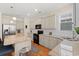 Well-lit kitchen featuring ample cabinet space, granite countertops, stainless steel appliances, and an island at 309 Foxpath Loop, Myrtle Beach, SC 29588