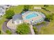 Aerial view of a community pool with lounge chairs and shade umbrellas at 309 Foxpath Loop, Myrtle Beach, SC 29588