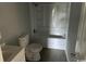 Bathroom featuring a white sink, toilet, and bathtub with shower at 321 Circle Heights Dr., Loris, SC 29569