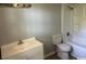 Bright bathroom with a white sink, toilet, and bathtub shower combo at 321 Circle Heights Dr., Loris, SC 29569
