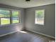 Bedroom featuring two windows for natural light and wood-look flooring at 321 Circle Heights Dr., Loris, SC 29569