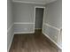 Cozy living room featuring fresh paint, white trim, and durable wood-look flooring at 321 Circle Heights Dr., Loris, SC 29569