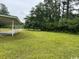 View of side yard, showing mature trees and ample space at 321 Circle Heights Dr., Loris, SC 29569
