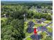 An aerial view shows the location of the home relative to a neighborhood pond and the surrounding community at 321 Sanctuary Ct., Myrtle Beach, SC 29588