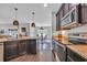 Modern kitchen with stainless steel appliances, granite countertops, and pendant lighting at 321 Sanctuary Ct., Myrtle Beach, SC 29588