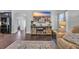 Cozy living room featuring a large TV, stylish rug, and comfortable leather seating at 321 Sanctuary Ct., Myrtle Beach, SC 29588
