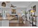 Cozy living room with hardwood floors, a ceiling fan, and tan leather sofa at 321 Sanctuary Ct., Myrtle Beach, SC 29588