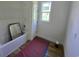 Compact bathroom featuring a tub and window, ideal for personalizing into a comfortable space at 3619 Allentown Dr., Conway, SC 29526