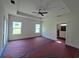 Spacious bedroom boasts a tray ceiling, ample natural light, and a ceiling fan for added comfort at 3619 Allentown Dr., Conway, SC 29526