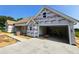 View of the home's exterior during construction, featuring a garage and unfinished landscaping at 3619 Allentown Dr., Conway, SC 29526