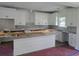 New kitchen with white cabinets, granite countertops and an island at 3619 Allentown Dr., Conway, SC 29526