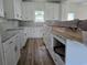 New kitchen features white cabinetry, and a granite countertop at 3619 Allentown Dr., Conway, SC 29526