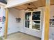 A view of the covered patio, featuring a ceiling fan and natural wood columns at 3619 Allentown Dr., Conway, SC 29526