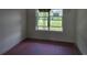 Bright and airy room with large window, natural light, and a modern chandelier for a cozy feel at 3619 Allentown Dr., Conway, SC 29526