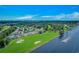 Beautiful aerial view of golf course community, waterway access, and lush green landscape under a bright blue sky at 4018 Fairway Lakes Dr. # 4018, Myrtle Beach, SC 29577